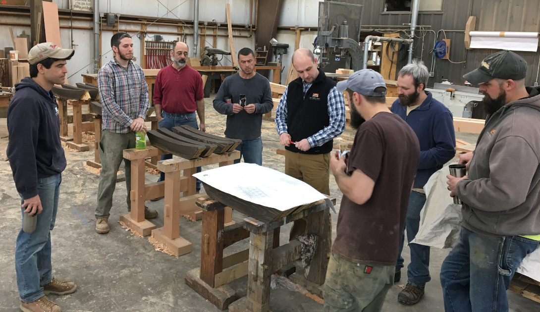Focused concentration from our timber framers as Bryan hosts a kick off briefing for an upcoming build.