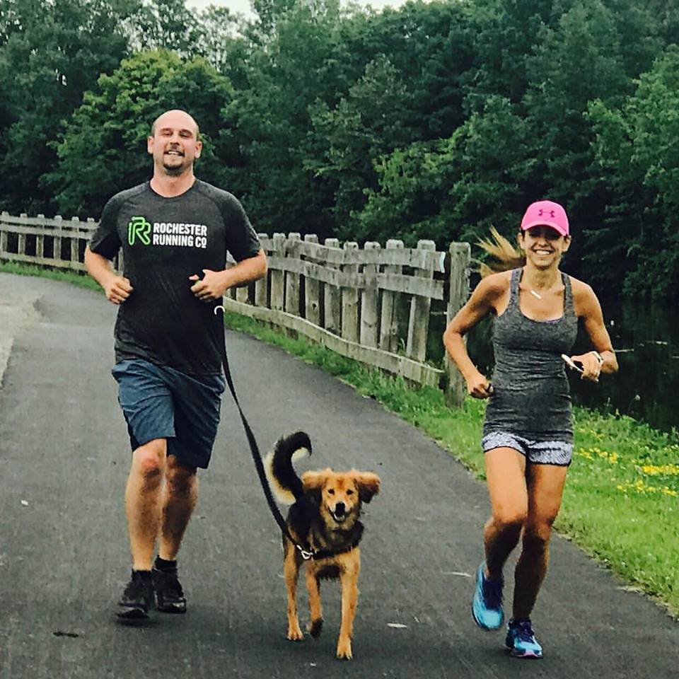 Running is a family affair: Bryan, Jillian, and four-legged sidekick Reilly cover some miles