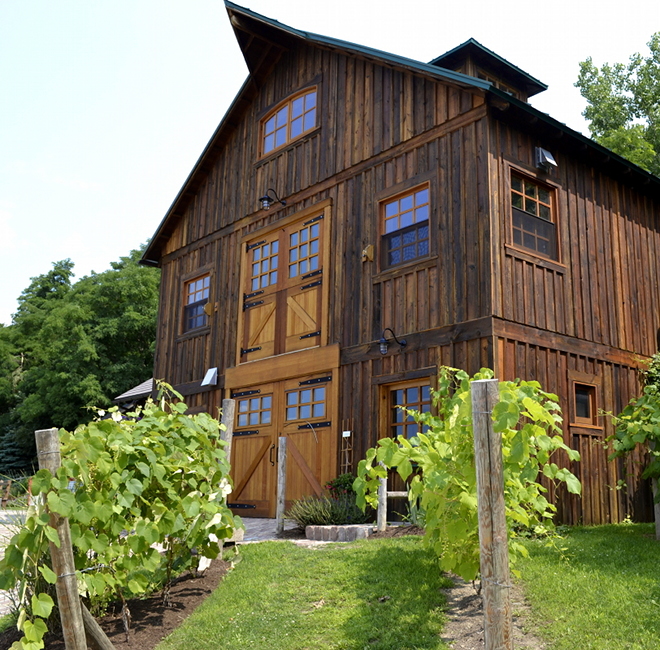 The upper and lower set of doors make use of strap hinges on this Keuka Lake vineyard barn.