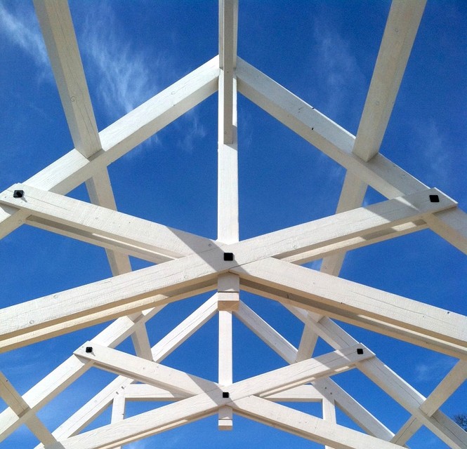 Split and painted scissor trusses with integrated metal; Bryan’s favorite truss style due to its complexity and intricacies.