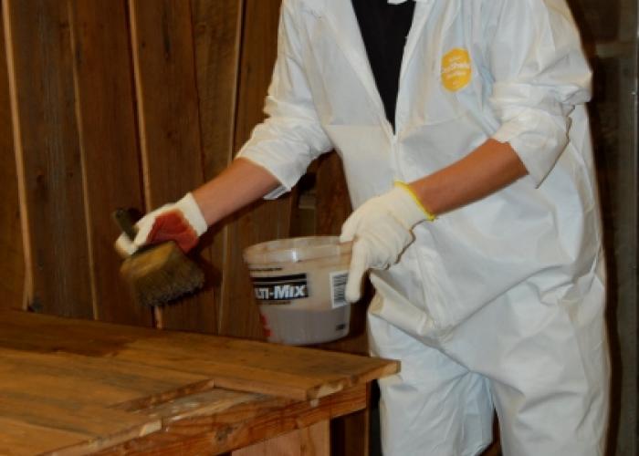 jered_applies_stain_to_reclaimed_wood.jpg