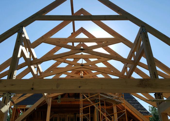 timber_frame_raising_scissor_truss_with_metal_connections.jpg