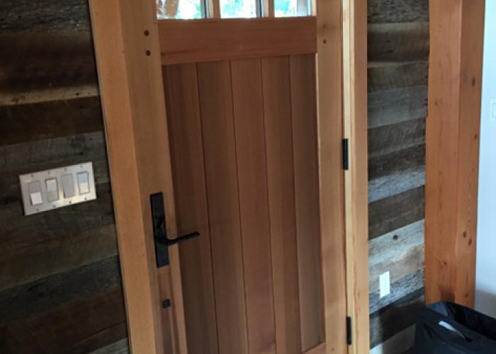 barn_siding_with_reclaimed_vat_door.jpg