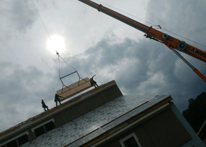 st_pius_sip_roof_panel_install.jpg