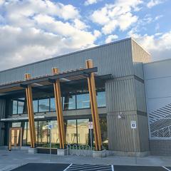 Glulam posts add a natural flourish to an entryway, perfect for an outdoor equipment retailer.