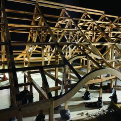 A view of Acadia National Park Gateway Center while under construction, showing the traditional timber frame incorporating glulam elements.