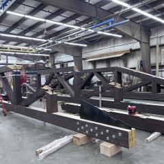 This progress shot shows off some exposed joinery waiting for a glulam beam to complete the truss - like our traditional timberframing, the precision craft work will allow it to fit perfectly with all the other pieces.