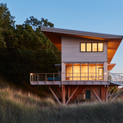 Glulam engineering in this coastal home provides a literally elevated experience, satisfying aesthetics as well as the building's footprint amongst the dunes.