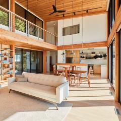 Glulam construction in residential projects highlights the grain and natural beauty of the wood, adding warmth to any space.