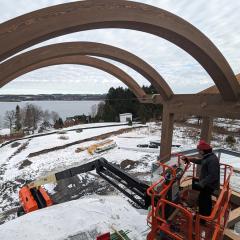 Engineered timber can be made into curved beams, as seen on this snowy install.