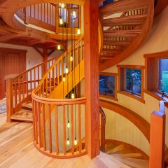 Glulam framing enables the custom shapes to accommodate special design elements, including this silo-like stairwell.